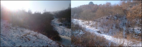 성자산성 북문터. 양쪽으로 솟은 산릉선을 타고 성벽이 갈라지며 가운데 작은 계곡을 가로지른 성문터로 흘러내리는 개울물이 추위에 얼어 있었다. 